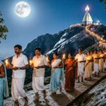 Pilgrims walking around Arunachala hill at night during Giri Pradakshina.