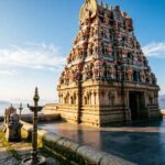 Hilltop view of Arulmigu Dhandayuthapani Swamy Temple in Palani with temple structure and sky backdrop.