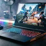 Gaming laptop with RGB keyboard displaying an action game setup.